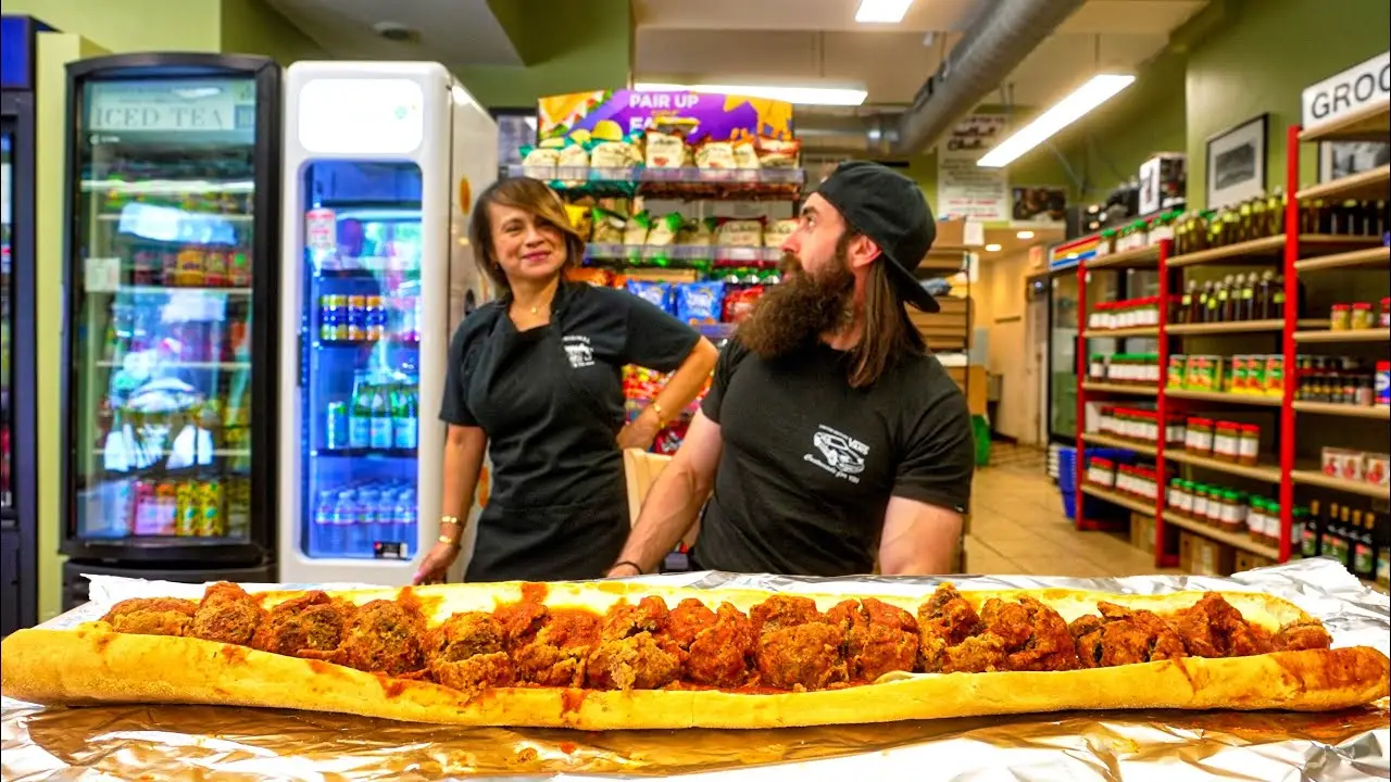 WIN $50 CASH IF YOU CAN FINISH THIS GIANT MEATBALL SUB IN CHICAGO! | BeardMeatsFood